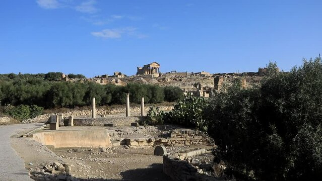 Sunny day at the ancient Roman ruins in Dougga with clear blue sky