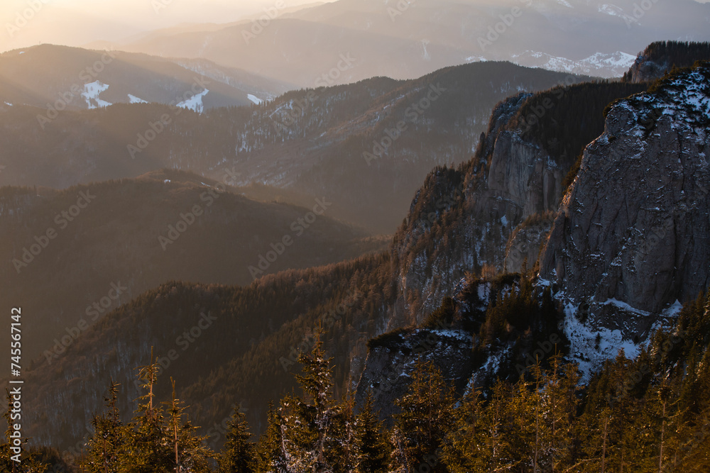 Wall mural beautiful sunrise at winter in ceahlau mountains, romania