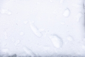 Winter snow. Snow texture Top view of the snow. Texture for design. Snowy white texture. Snowflakes.