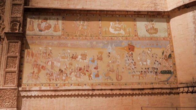 The majestic royal ancient fort of Jodhpur. Panning view of a wall paintings.