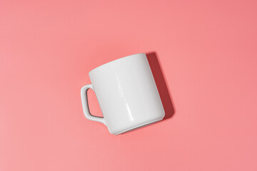 Ceramic mug mock up on pink background studio shot