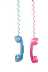 Vintage Telephone Handsets in Pink and Blue, A Nostalgic Communication Concept