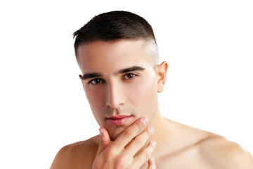 Young attractive brunet guy with perfect skin touching chin on white background