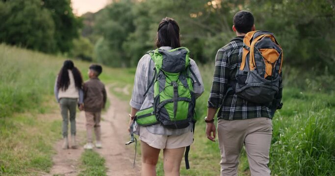 Family, hiking outdoor and back with backpack, bonding together and children with mom and dad. Wellness, walking and love with care, people and adventure in forest for exercise, health and trees