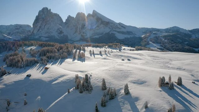 4k drone flight moving to the side footage (Ultra High Definition) of Alpe di Siusi village with Plattkofel peak on background. Splendid morning view of Dolomite Alps. Bright outdoor scene of Ityaly.