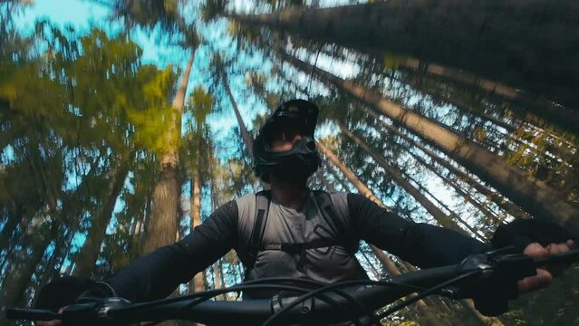 Cinematic Mountain Bike Shot of Man Riding in Forest