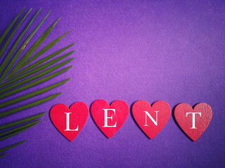 Lent Season, Holy Week, Ash Wednesday concepts. Word lent on wooden heart shape and palm leaf in...