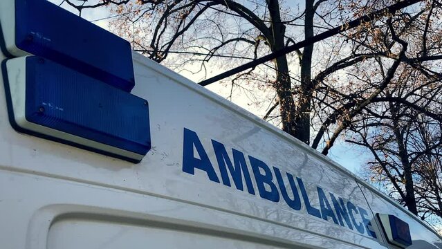 Ambulance medical van. Closeup of flashing blue signal light. Healthcare concept