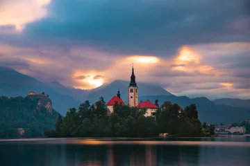 Fotobehang Amazing View On Bled Lake, Island,Church And Castle With Mountain Range © erika8213
