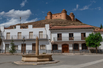 The village La Calahorra, in the province of Granada, Spain with Castillo de La Calahorra on top of...
