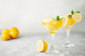 Summer limoncello margarita cocktail with lemons and mint in a glass - obrazy, fototapety, plakaty