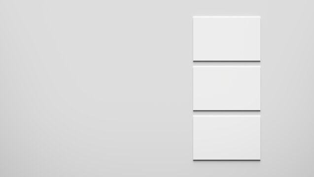 Three blank or empty business cards on gray background.