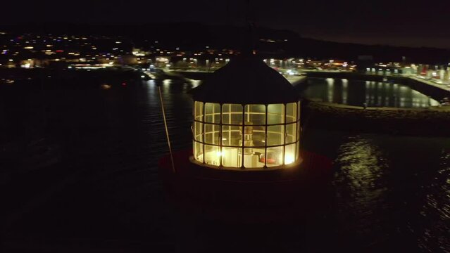 Howth harbour lighthouse house lit at night. Details inside lantern. Close up shot.