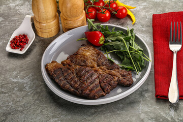 Grilled chuck roll steak with arugula