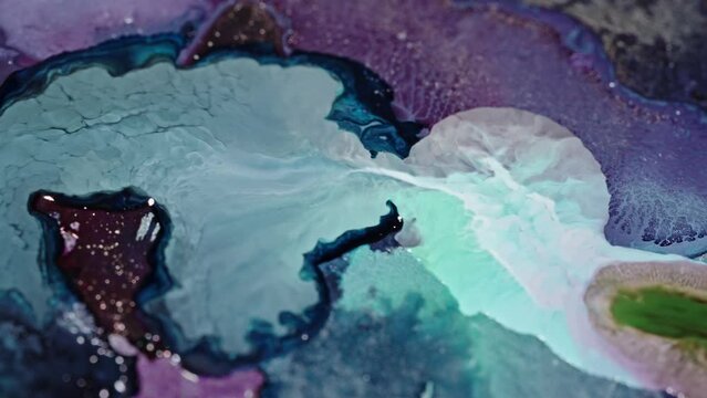 Vibrant ink colors diffusing in water, creating an abstract marbling effect