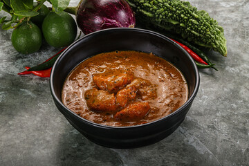 Indian cuisine - chicken curry with spices