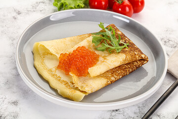 Russian pancake with red caviar