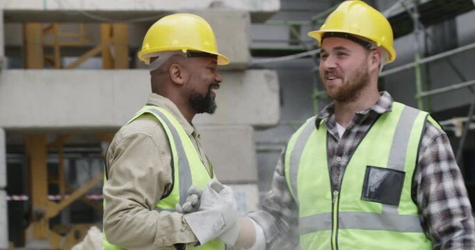 Man, engineer and handshake on construction site for thank you, partnership or teamwork. Male person, contractor or engineering friends shaking hands for agreement, meeting or deal in architecture