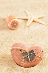 Sand with shells and heart. Summer background, for love.  - 745614596