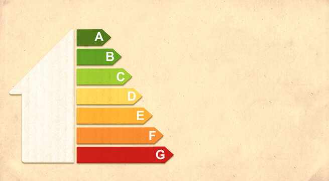 Energy efficiency chart on cardboard texture. Horizontal banner with eco paper texture and energy efficiency house symbol. Energy class, bio energetic and ecology concept