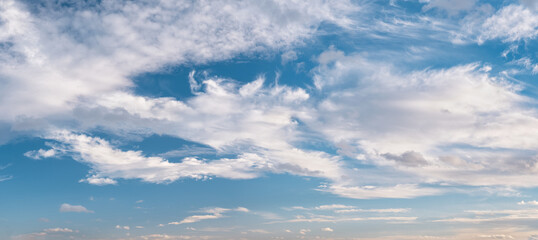 Panoramic background of blue sky with beautiful clouds