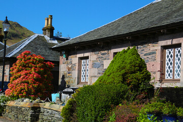 Traditional beautiful brick building in the small town of Luss, Scotland