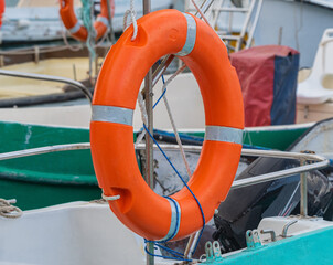 Lifebuoy hanging on the powerboat
