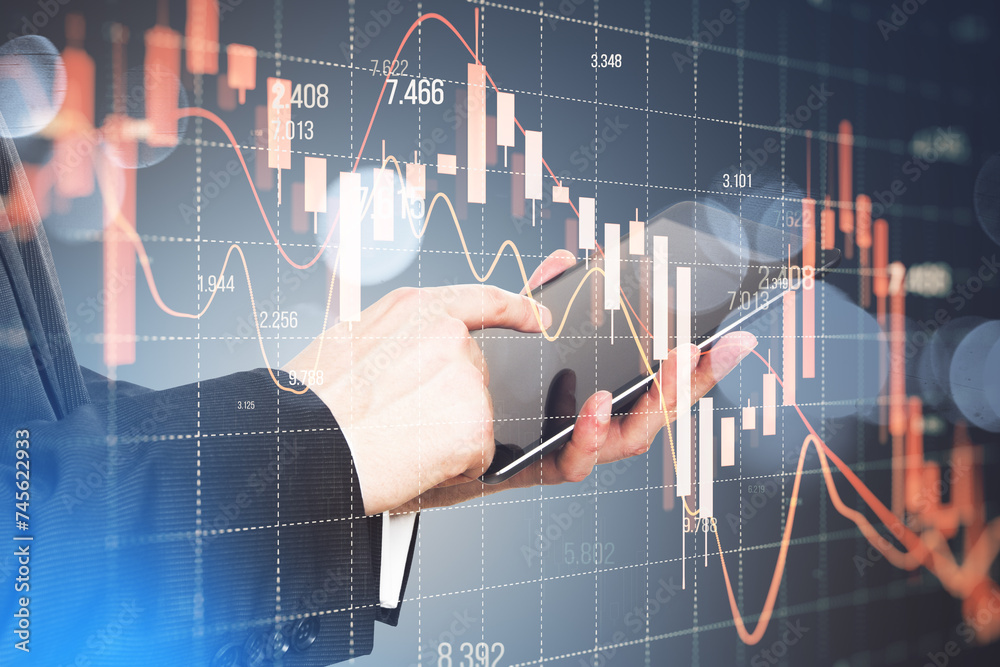 Poster close up of businessman hand using smartphone with falling red forex candlestick chart on blurry bac