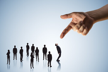 Hand pointing at crowd of businessmen on light wallpaper. Worker management concept.