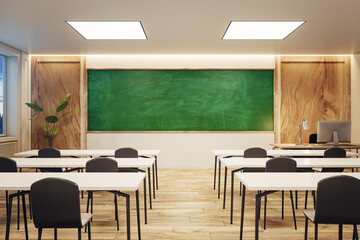 Evening view of a modern classroom with green chalkboard and warm lighting, education concept. 3D Rendering