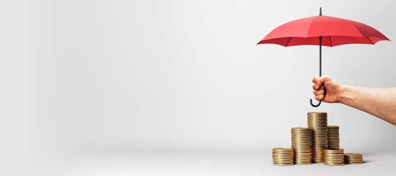 A hand firmly holds a red umbrella, shielding a rising sequence of coin stacks, hinting at financial security