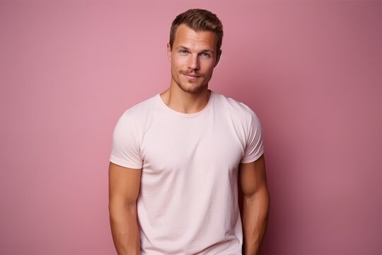 Portrait of handsome young man in a white t-shirt.