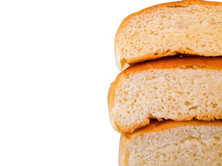 Soft white bread resting with one slice resting on a white background with negative space for text. close up and selective focus isolated on white background.