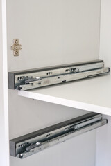 Drawer guide rail, mounted in a new kitchen cabinet.