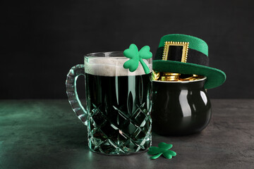St. Patrick's day celebration. Green beer, leprechaun hat, pot of gold and decorative clover leaves...