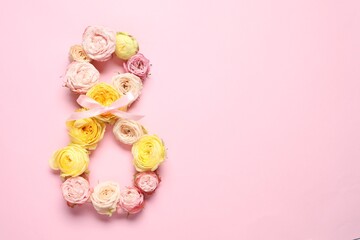 8 March greeting card design made with beautiful flowers on pink background, top view. Space for text
