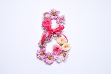 8 March greeting card design made with beautiful flowers on white background, top view. Space for text