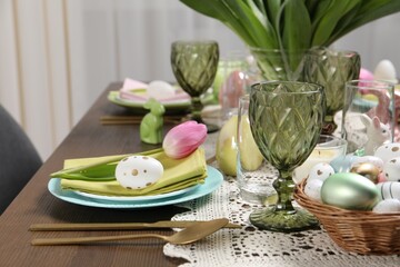 Festive table setting with painted eggs. Easter celebration
