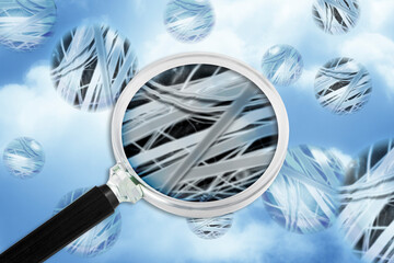 Dangerous asbestos particles with airborne fibers seen through a magnifying glass - Concept image