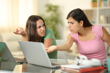Angry students arguing studying online