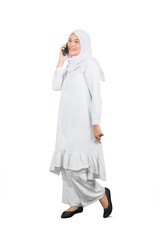 Asian muslim woman talking on phone