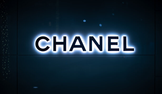 BEVERLY HILLS - February 25, 2024: Chanel logo glowing in the dark on Chanel shop wall on Rodeo Drive in Los Angeles, California.