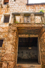 Fototapeta premium 'House Within a House' or Kuca U Kuci in Bol, Brac Island, Croatia. In 19th century, a newer house was built around an existing house which was never demolished
