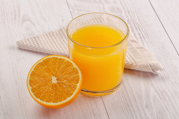 Sweet fresh orange juice in the glass