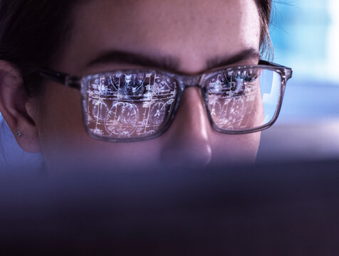 Neurosurgeon examining medical x-ray of brain on computer