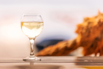 Glasse of white wine on wooden table
