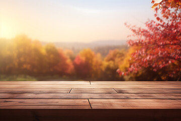 Wooden table top on blurred autumn background. Mock up for display of product