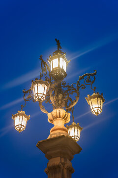 Spain, Andalusia, Seville, Fuente Farola street light at night