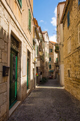 Fototapeta na wymiar Historic residential buildings in a quiet back street in the city of Split in Croatia