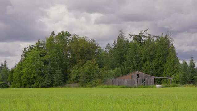 Old Barn on Farmland During Overcast Day
